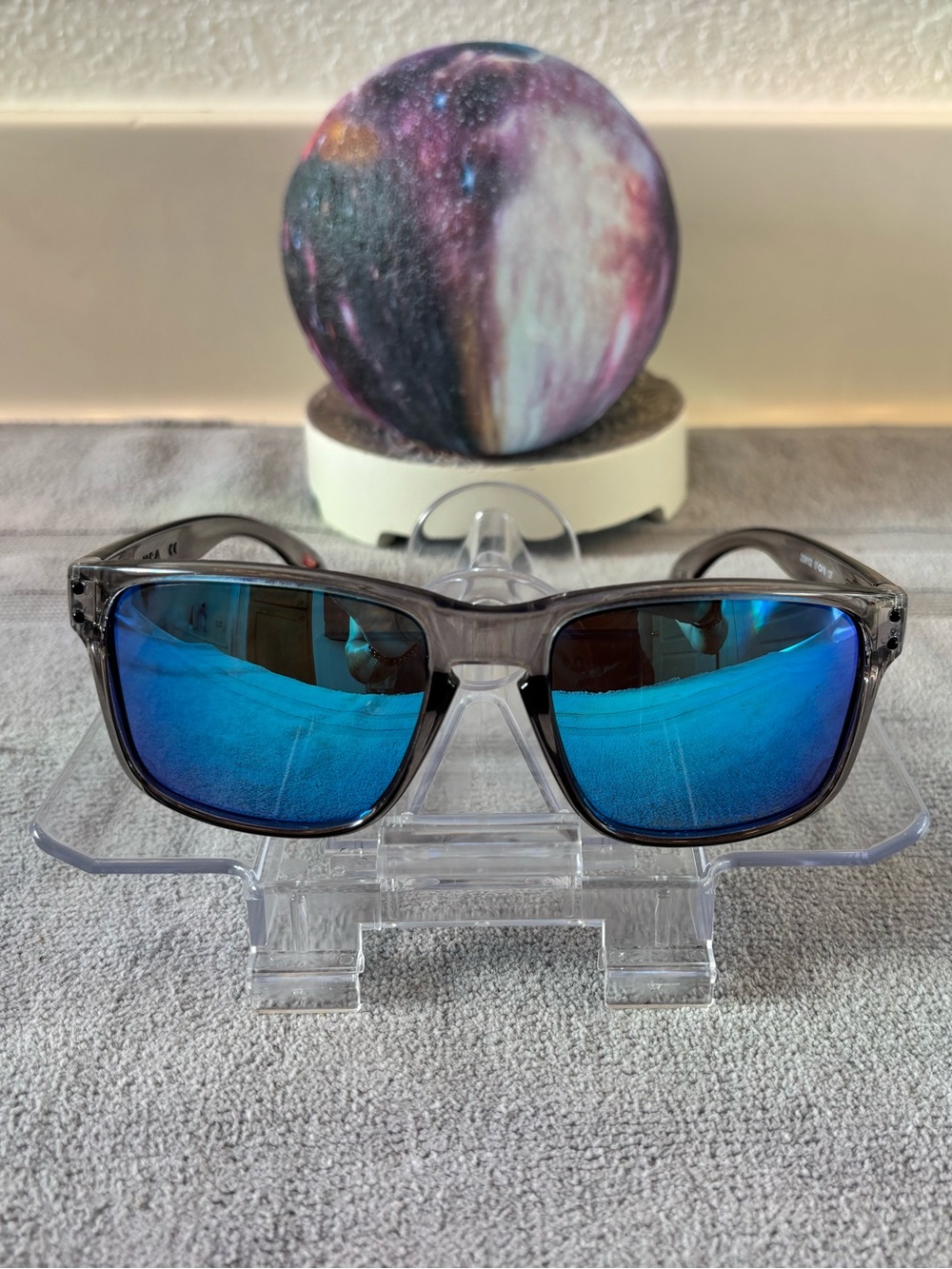 Oakley Men's Sunglasses with Blue Mirror Lenses and Clear Gray Frame